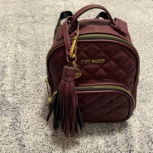 Small Steve madden backpack with matching wallet.